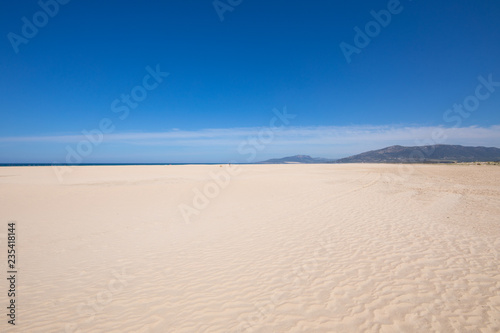 landscape of beautiful sandy big and lonely beach Los Lances, in Tarifa, Cadiz, Andalusia, Spain