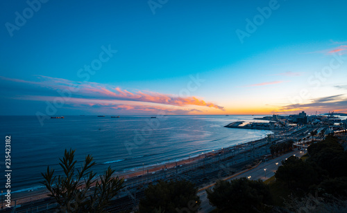 Teal and orange view of Balco del Mediterrani in Tarragona, Spain, during twilight period. photo