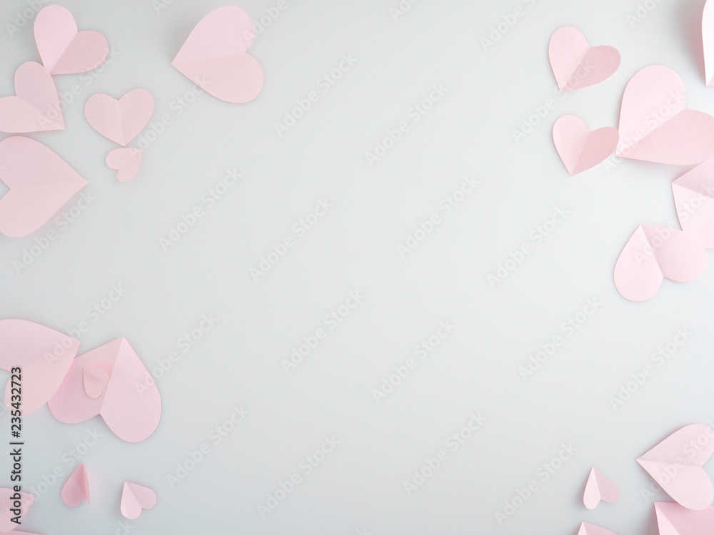 Pink paper hearts placed on white background.