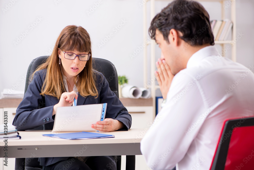 Man and woman discussing in office Man and woman discussing in office