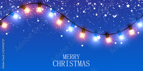 Merry Christmas banner with garland of shiny decorative lanterns and confetti.