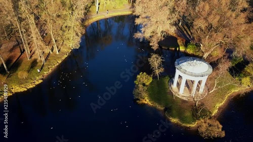 3 in 1 aerial; drone flight over city park; rest and recreation area with pretty pond and floating ducks; autumn sunny day; good freetime for leisure activity; calm and relax conditions in big city photo