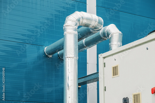 Industrial cooling unit for central ventilation system standing outside the modern manufacturing photo