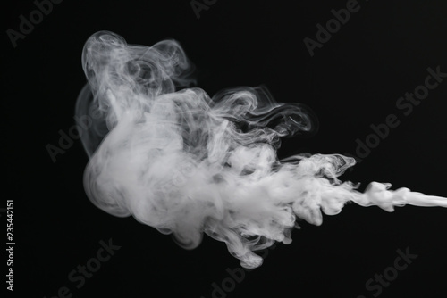 closeup abstract stream of vapor over black background