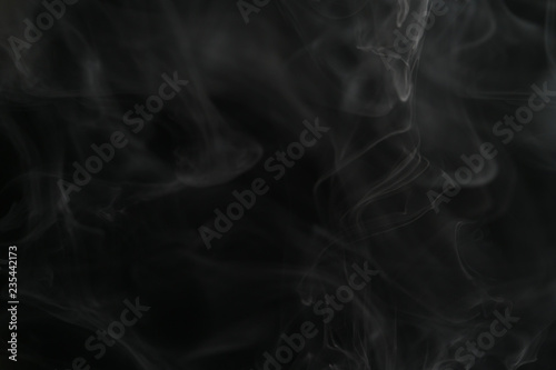 closeup abstract vapor over black background for backdrop or overlay