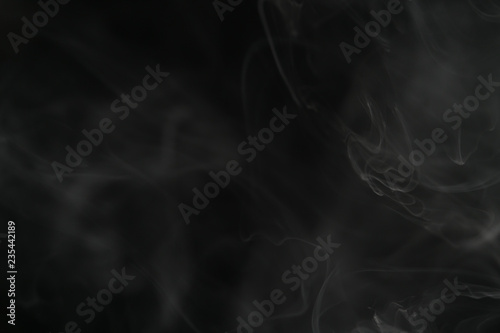 closeup abstract vapor over black background for backdrop or overlay