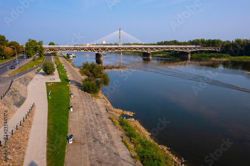 Plakat w ramie Warsaw, Poland - Panoramic view of the Vistula river with Most Srednicowy railway bridge and Powisle district of Warsaw