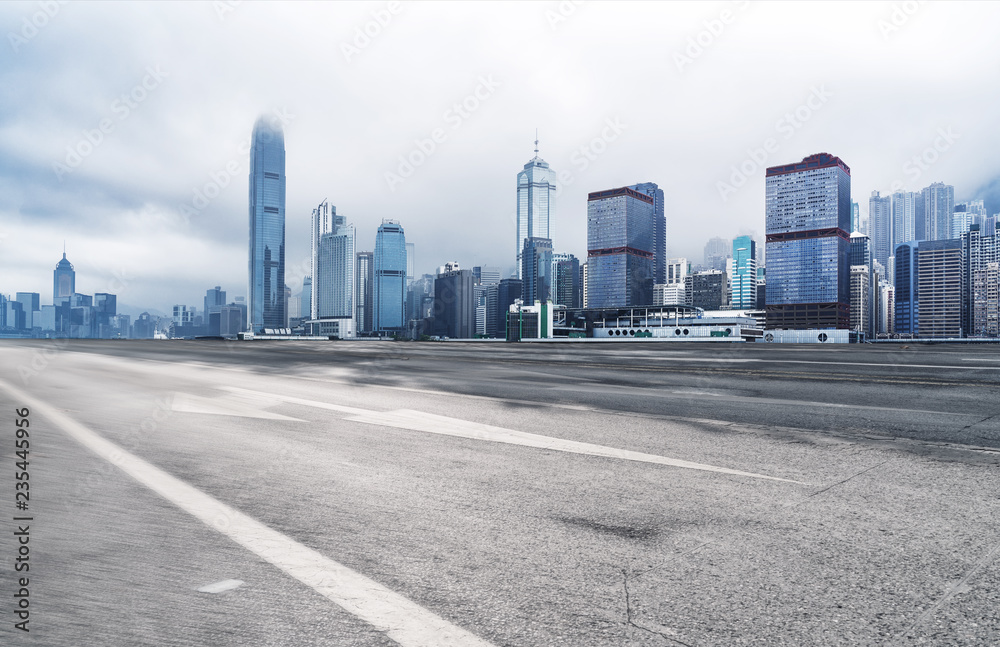 Panoramic skyline and modern buildings with empty road in Hong Kong
