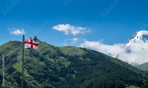 Mount Kazbek and georgian flag, Georgia