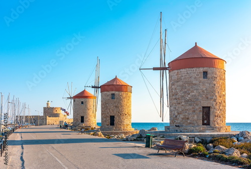 Windmills and Fort of St. Nicholas in Mandraki harbor  Rhodes island  Greece