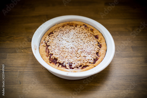 sweet cake with jam in ceramic form © Peredniankina