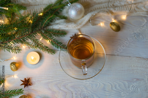 Tea cup, Christmas or new year decoration on modern wooden table. photo