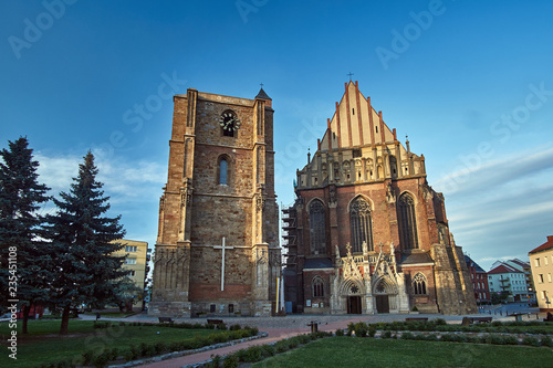 facade of a medieval Roman Catholic church in the Gothic style in Nysa..
