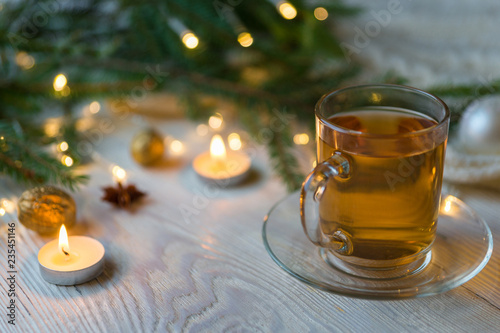 Tea cup, Christmas or new year decoration on modern wooden table. photo