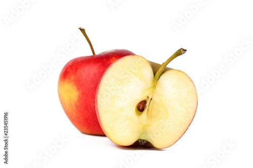 Red ripe apple with a half fresh sliced apple isolated on white