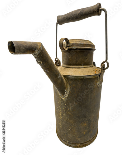 Old dirty oil can of tin with carrying handle isolated on white