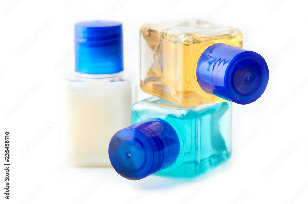 Shampoo and shower gel on a white background. Hotel cosmetic bottles isolated on white. Mini bottle set Shampoo and shower gel on a white background. Hotel cosmetic bottles isolated on white. Mini bottle set