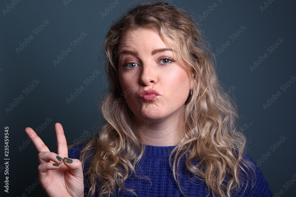 Woman in front of a colored background