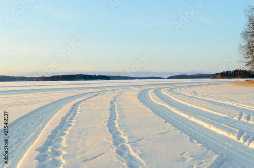 Foot steps on skandinavien winter frozen lake