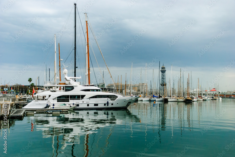 Yachts on the dock. Barcelona White ships in the city port. Spain.