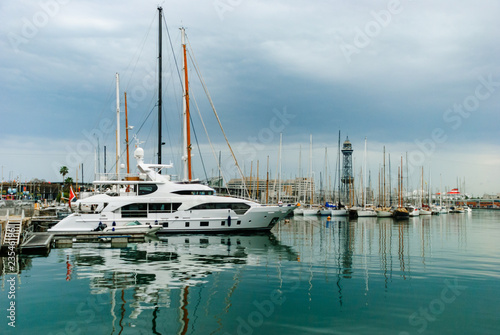Yachts on the dock. Barcelona White ships in the city port. Spain.