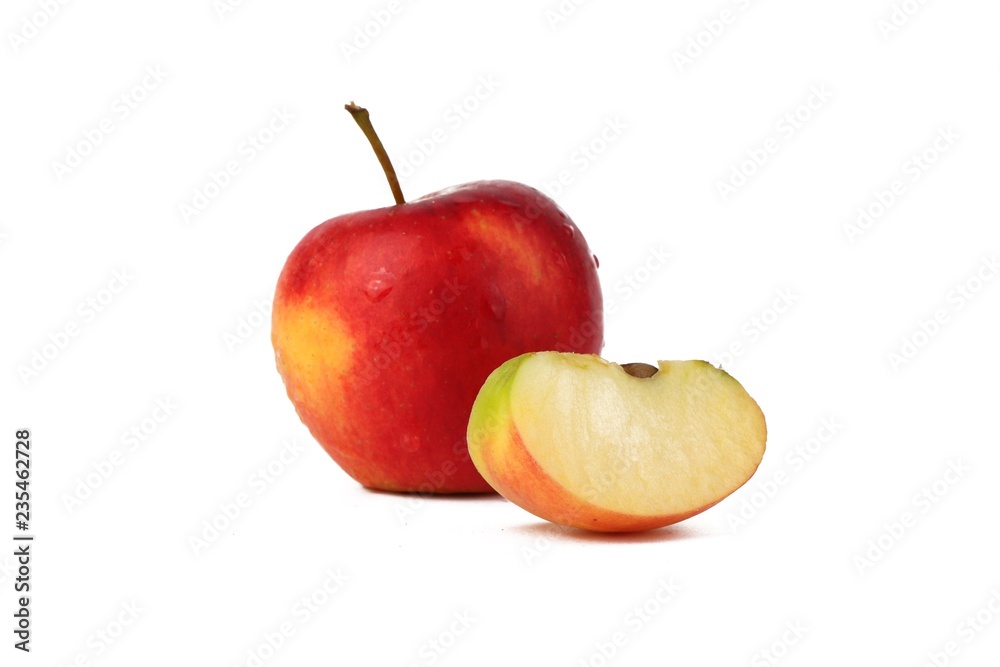 Red ripe apple with fresh sliced apple piece isolated on white Red ripe apple with fresh sliced apple piece isolated on white