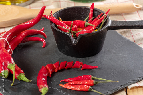 red chili peppers on a slate