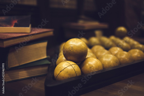 Photography Billiard balls on a billiard table with books