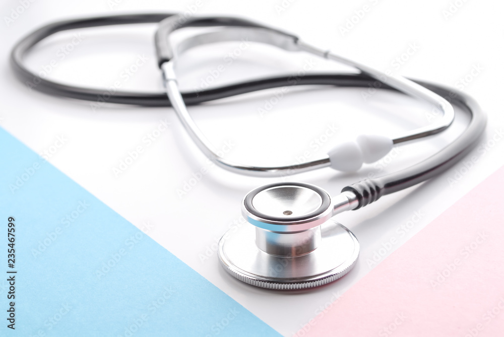 Stethoscope on white. Stethoscope on blue and pink background. Traditional stethoscope. Stethoscope on white. Stethoscope on blue and pink background. Traditional stethoscope.