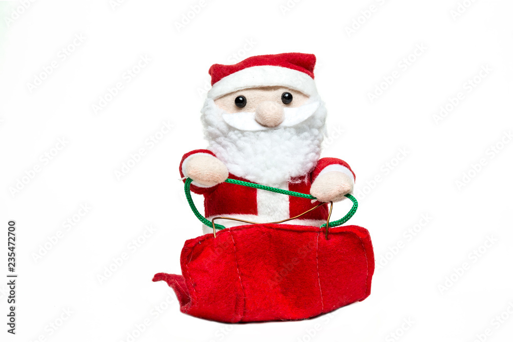 Doll Santa Claus on the sleigh on white background. merry christmas. Front