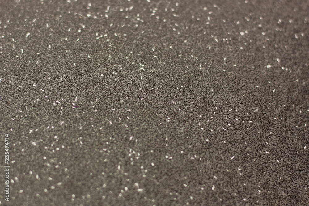 texture of cold drops on the glass. snowflakes glitter in the light. Blured. Selective focus