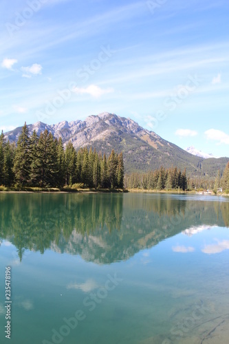 Fototapeta Naklejka Na Ścianę i Meble -  Calm Reflections On The Bow River, Banff National Park, Alberta
