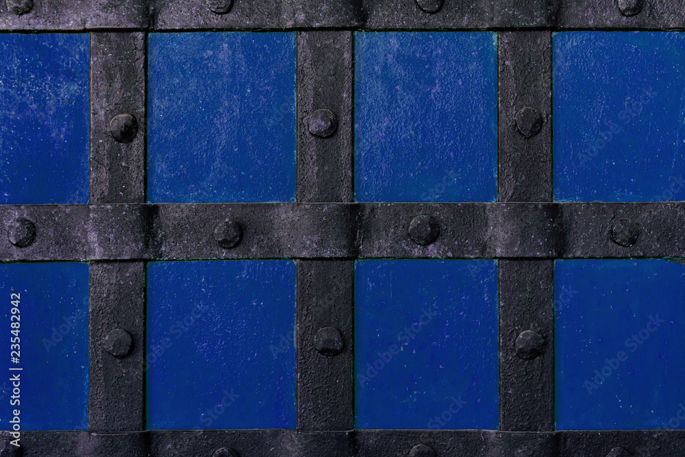 The background is painted with blue paint with metal beams and rivets. The background is painted with blue paint with metal beams and rivets.