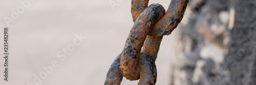 Closeup rusty chain link. Closely and inseparably connected