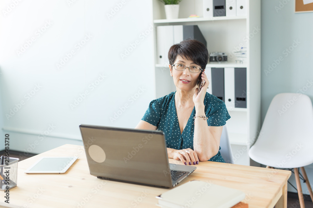 People, technology and communication concept - middle-aged woman calling on smartphone