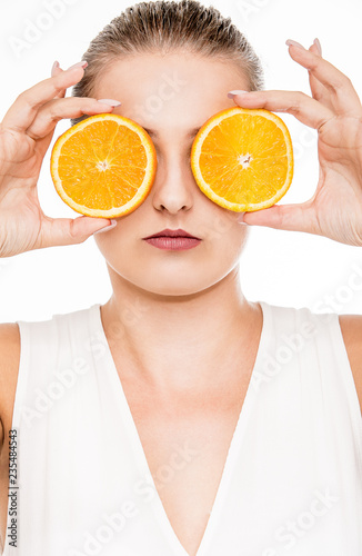Beautiful woman with tropical fruit