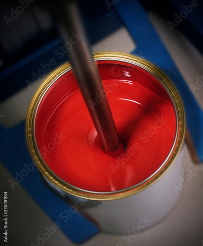 RED PAINT IN TIN ON MIXING MACHINE