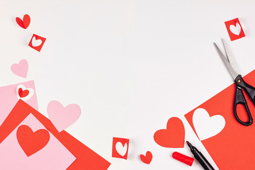 Red and pink paper hearts on white background. Valentine's day, love, wedding concept