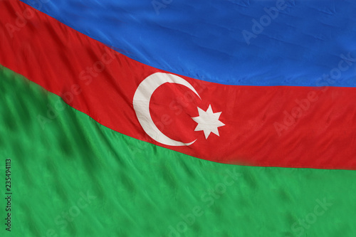 Piece of Azerbaijani flag . Flag of Azerbaijan. Realistic waving flag of Republic of Azerbaijan. Fabric textured flowing flag of Azerbaijan.