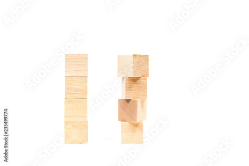 Light yellow wooden cubes on white background. Isolated on white. Business  finance  education