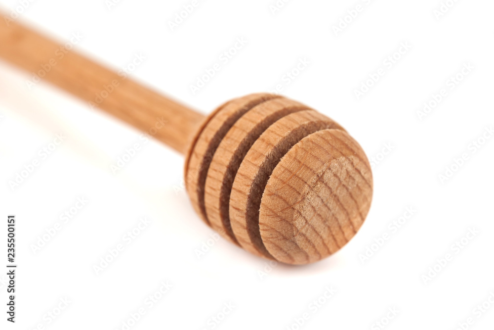 Wooden honey dipper isolated over white background Wooden honey dipper isolated over white background