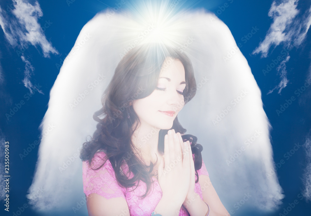 Beautiful young girl praying, protected by a guardian abstract angel