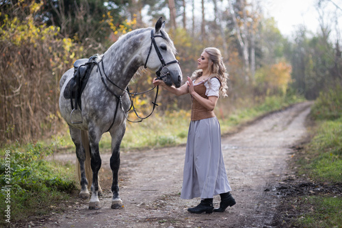 Fényképezés Young woman with a horse