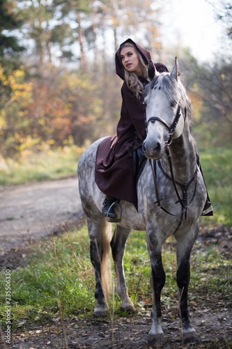 Young woman with a horse © Evgenia Tiplyashina