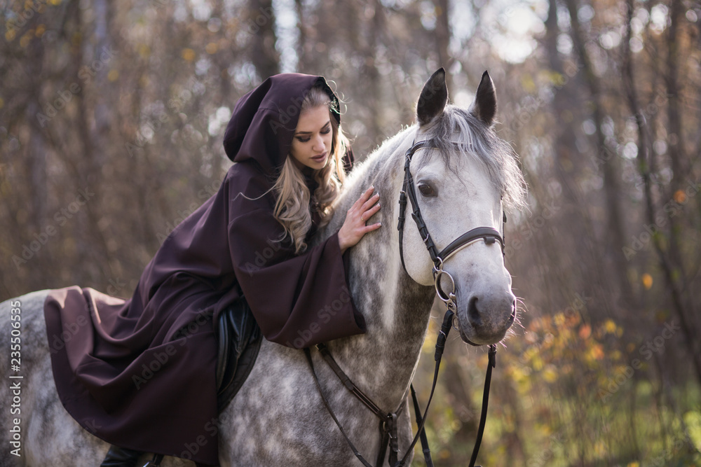 Obraz premium Young woman with a horse