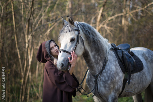 Young woman with a horse © Evgenia Tiplyashina