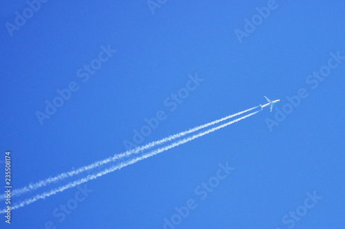 Jet plane with a trail in the sky