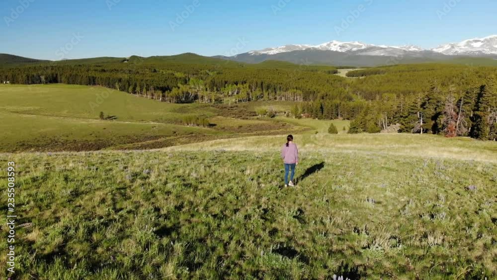 Woman walking near the Yellowstone National park in Wyoming USA from above. Aerial view drone shot
Woman walking near the Yellowstone National park in Wyoming USA from above. Aerial view drone shot