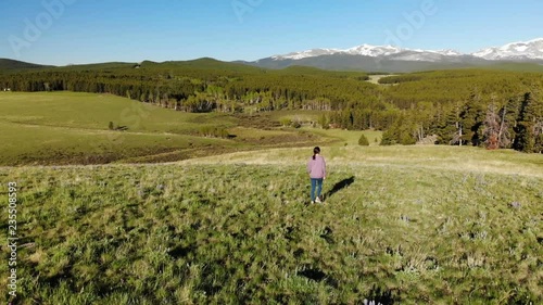 Wallpaper Mural Woman walking near the Yellowstone National park in Wyoming USA from above. Aerial view drone shot
 Torontodigital.ca