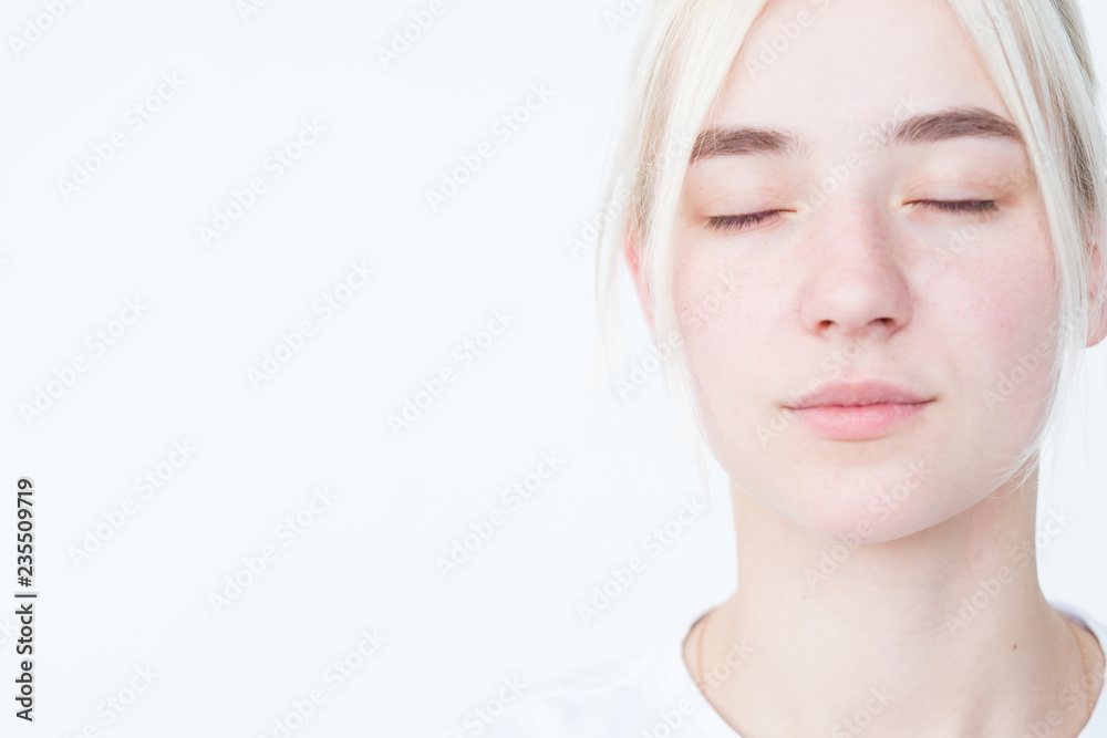 Naklejka premium pensive thoughtful mysterious beautiful woman with eyes closed. portrait on white background.